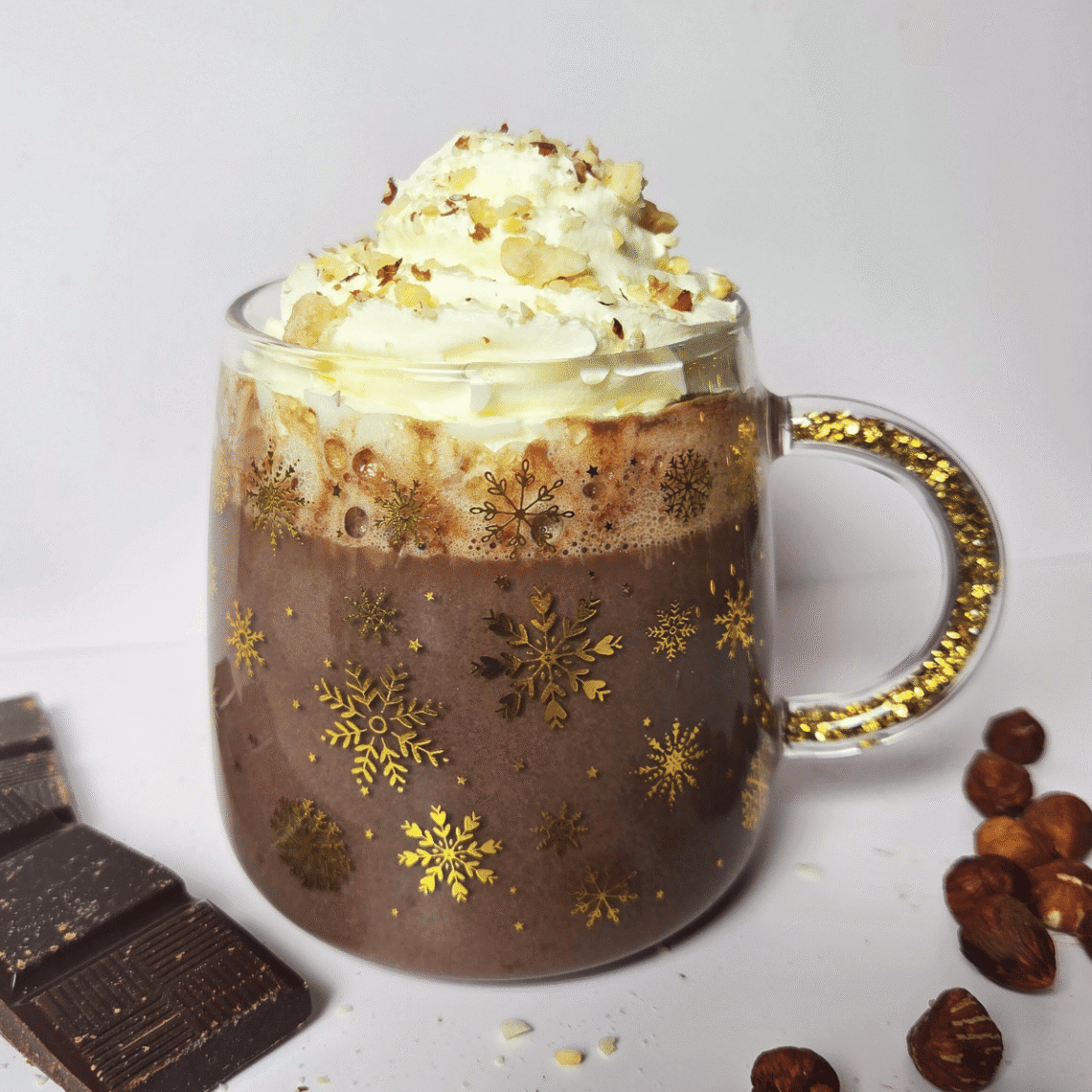 Nutella hot chocolate topped with whipped cream and chopped hazelnuts