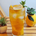 Sparkling Peach Honey Iced Tea with lemon slice and peach slices