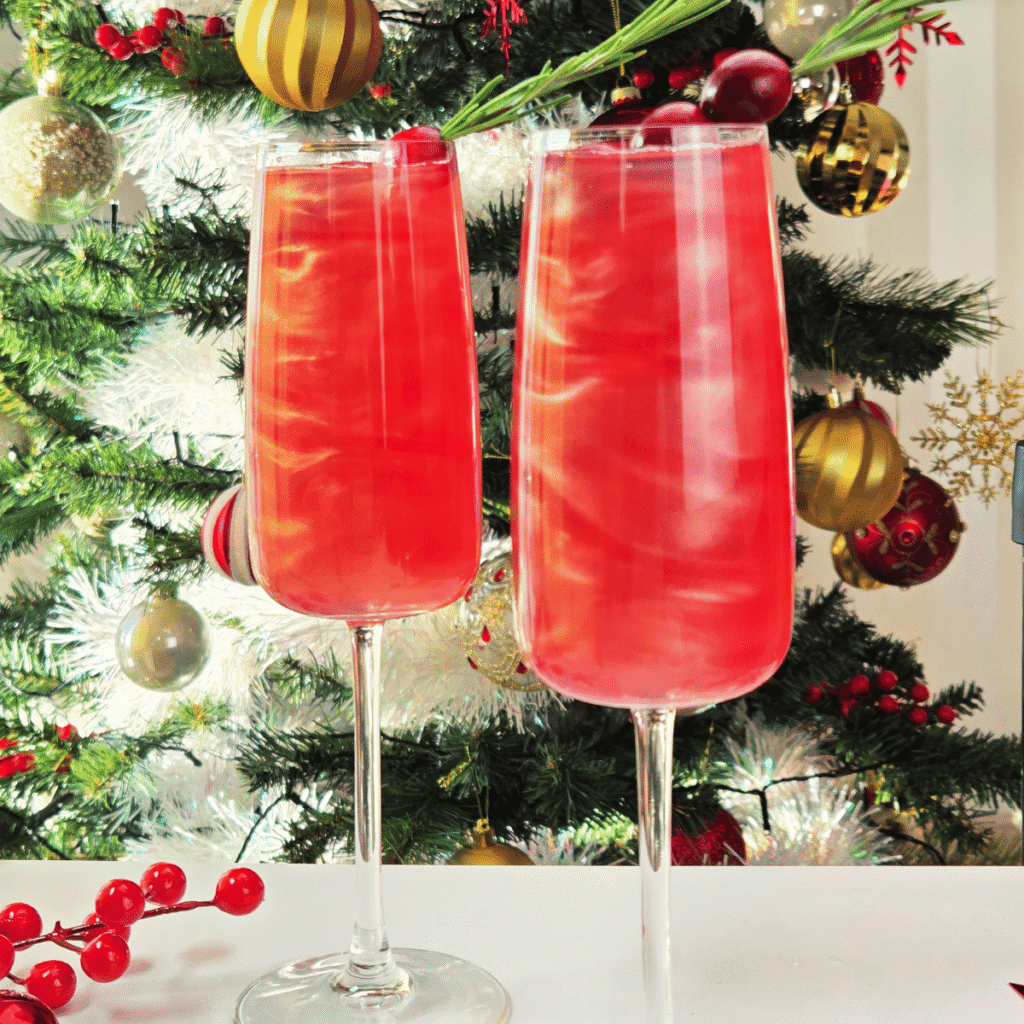 Sparkling Cranberry Mocktail in front of a Christmas Tree