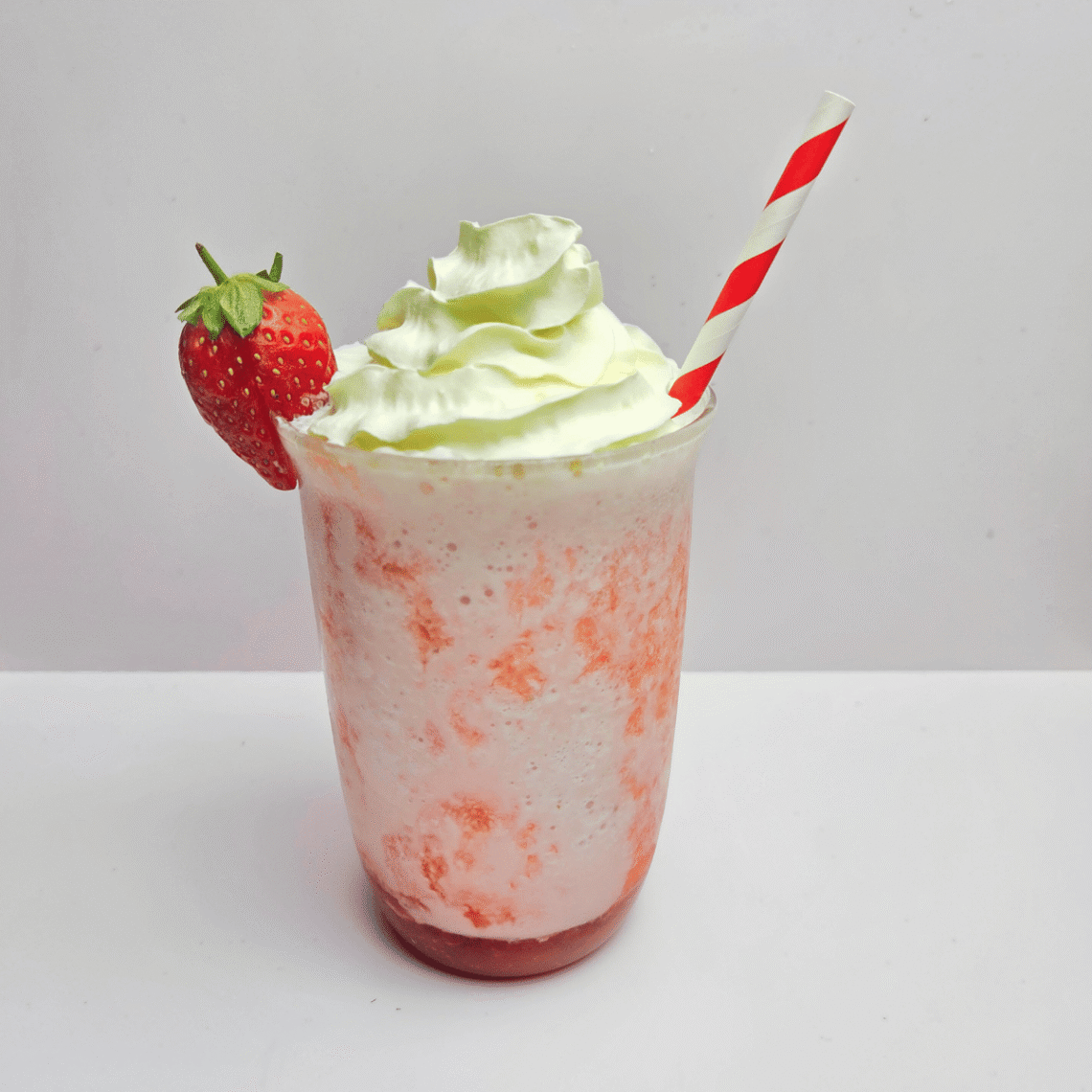 Strawberries and Cream Blended drink topped with whipped cream